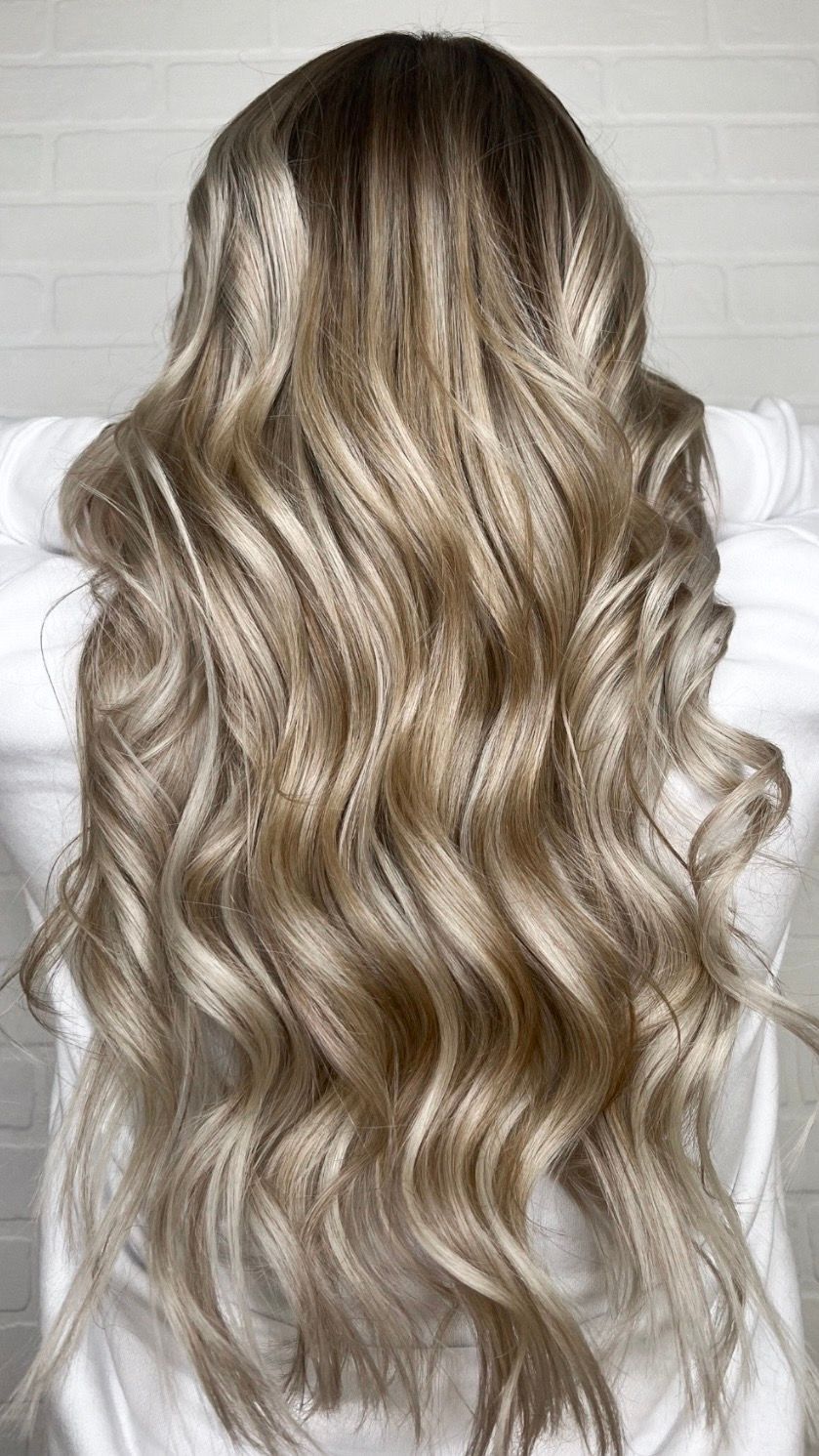 the back of a woman's head with long blonde hair
