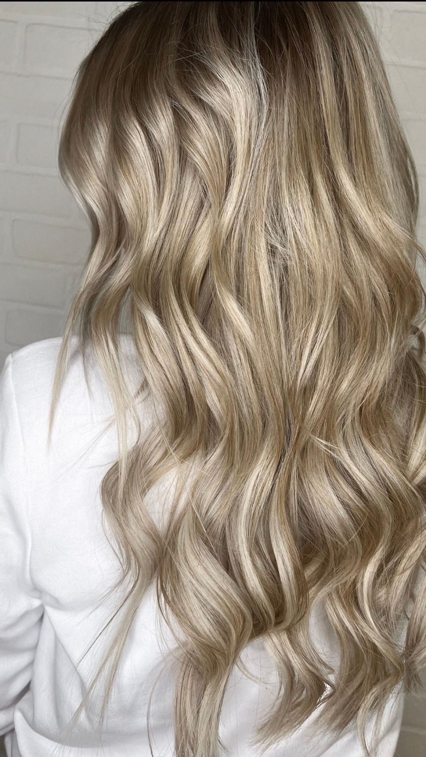 the back of a woman's head with blonde hair