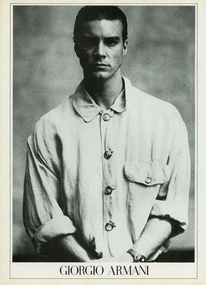 a black and white photo of a man in a shirt