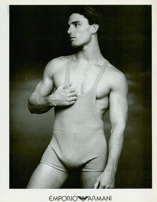 a black and white photo of a man in underwear