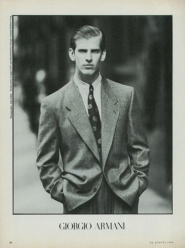 a black and white photo of a man in a suit