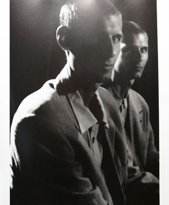 a black and white photo of two men