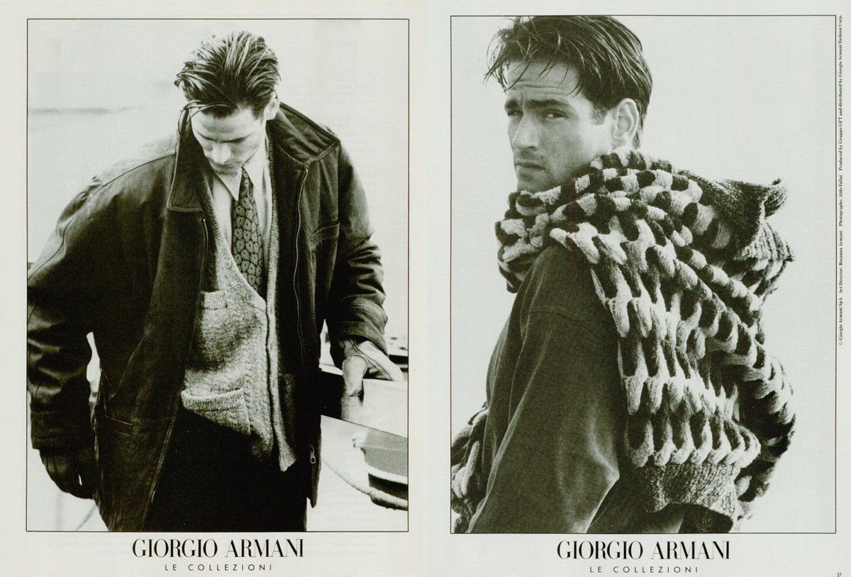 a black and white photo of two men wearing scarves