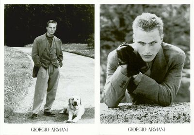 a black and white photo of a man and a dog