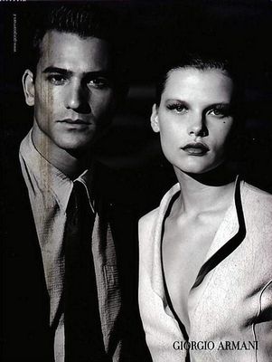 a black and white photo of a man and a woman