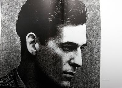 a black and white photo of a man's face