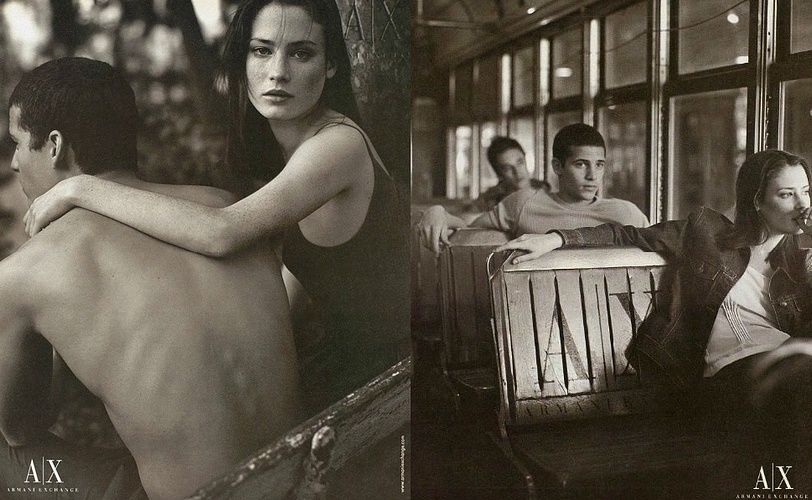 a black and white photo of a man and a woman on a bus