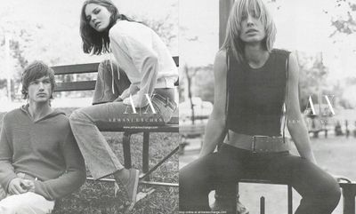 a black and white photo of two women sitting on a bench