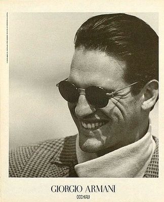 a black and white photo of a man wearing sunglasses