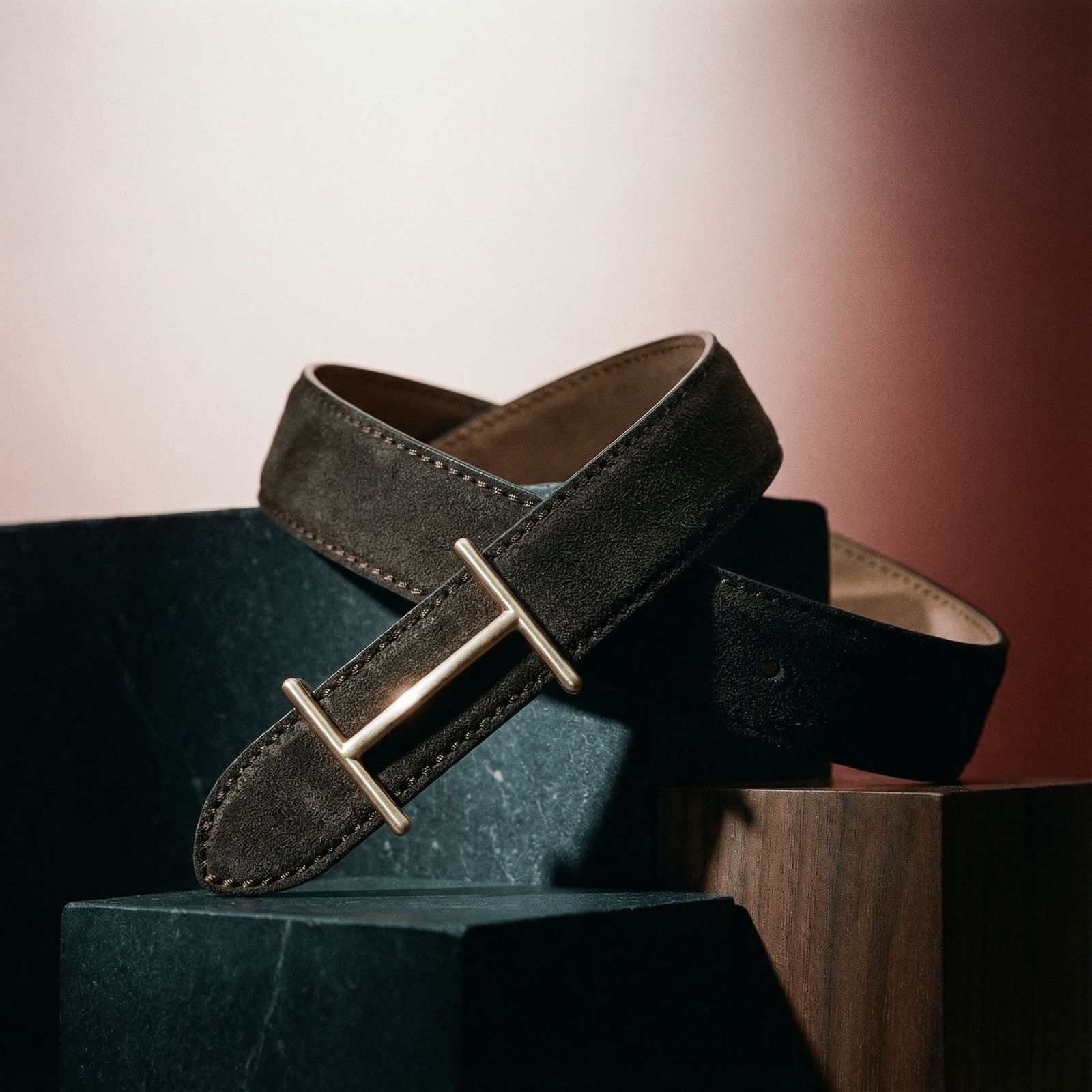 a black and brown belt sitting on top of a box