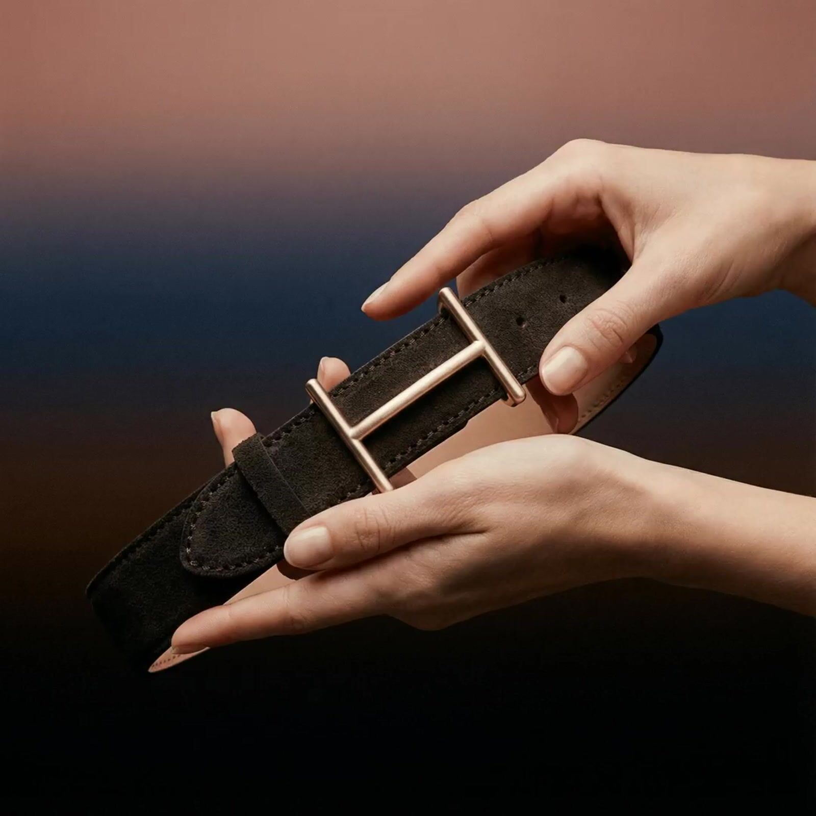 a person holding a belt in their hand