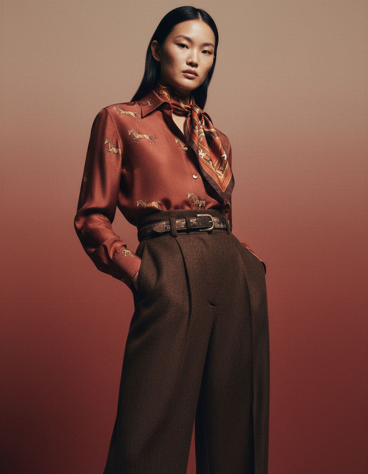 a woman in a red shirt and brown pants