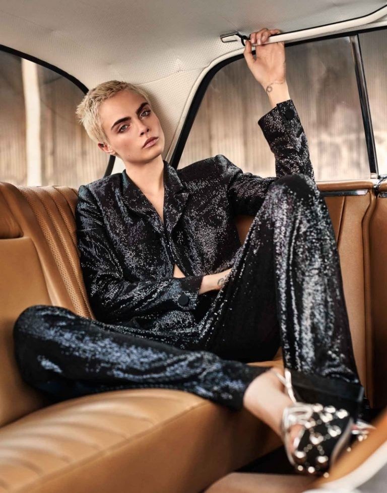 a man sitting in the back of a car