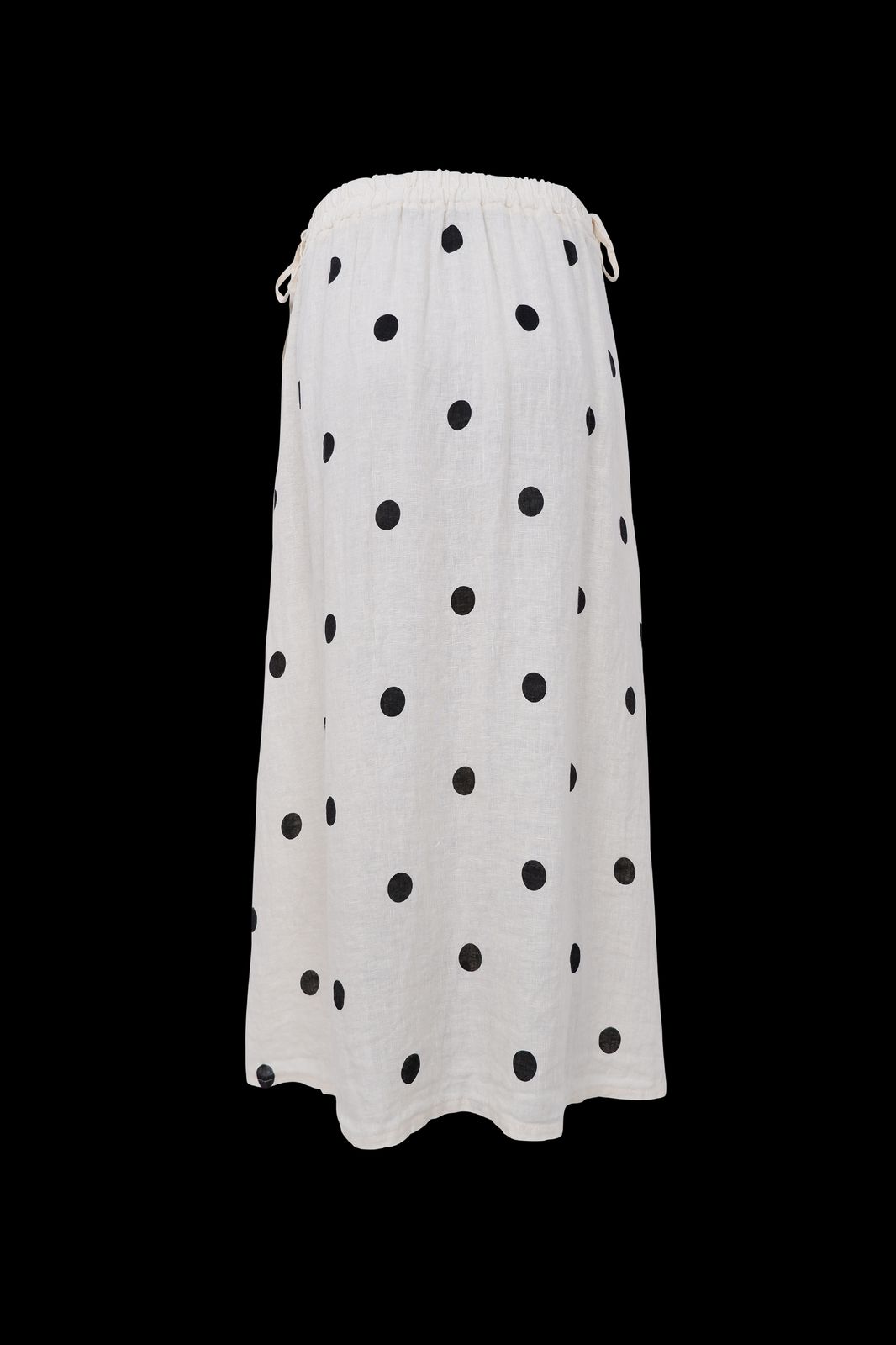 a white skirt with black dots on it