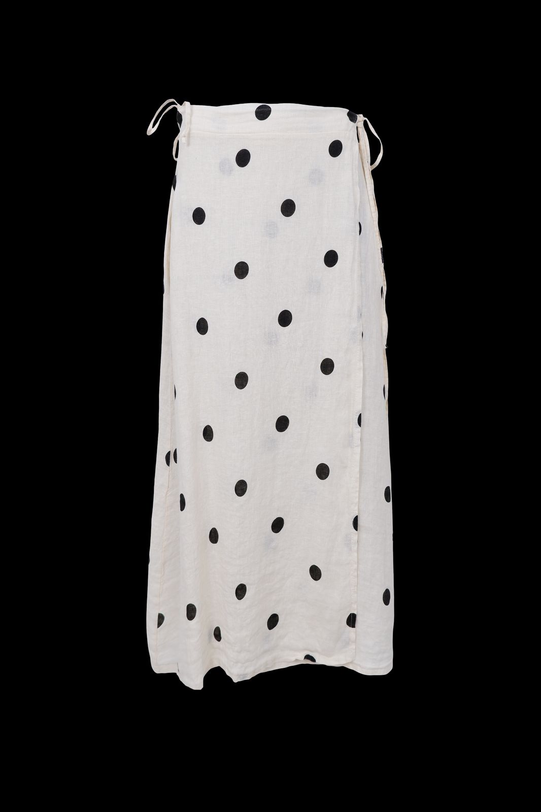 a white skirt with black dots on it