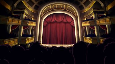 a theater with a red curtain and a stage