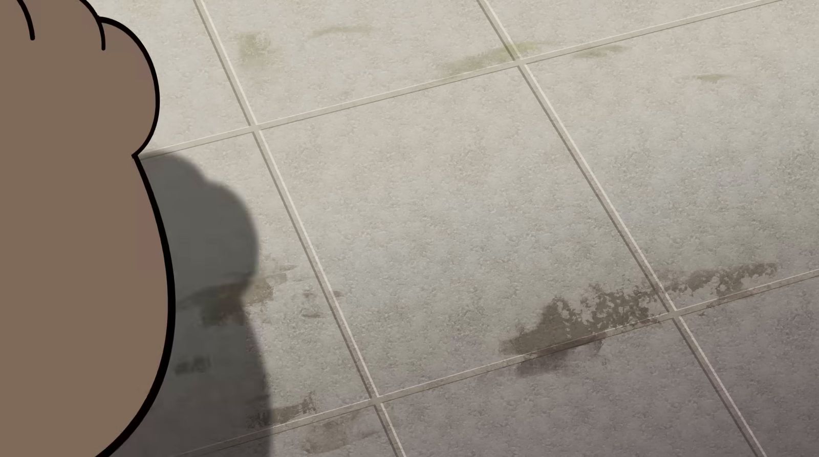 a person standing on a tiled floor next to a wall