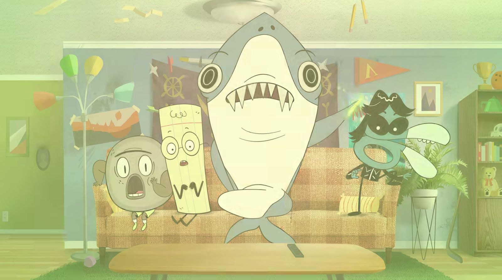 a living room with a cartoon shark on the coffee table