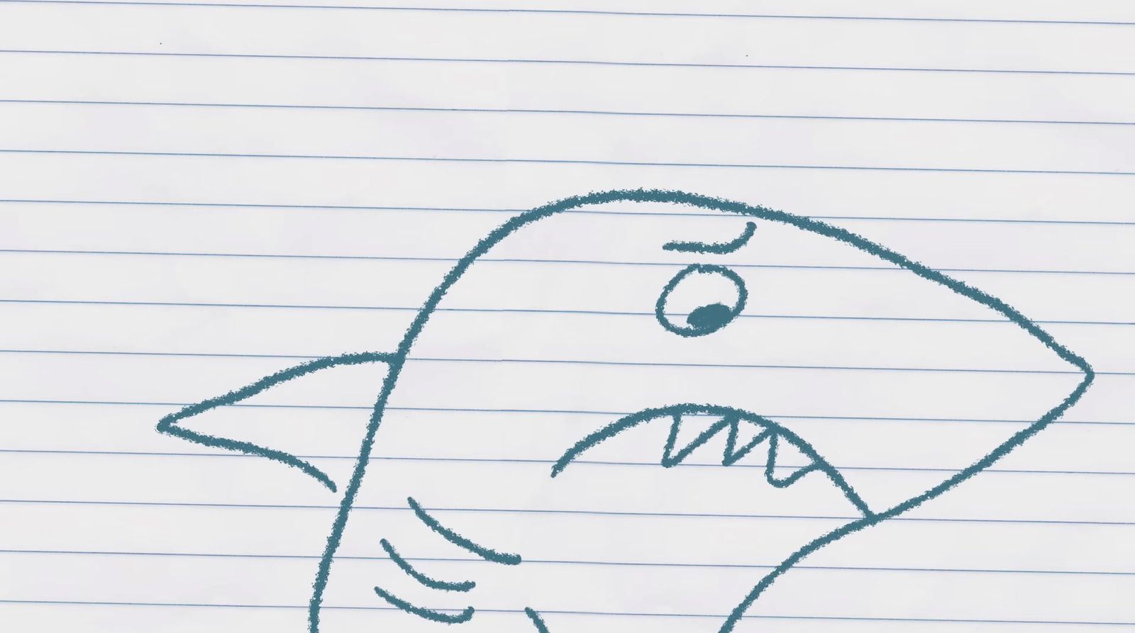 a drawing of a shark on lined paper