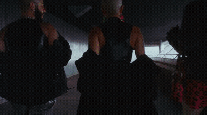 a group of people standing in a tunnel