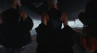 a group of people standing in a tunnel