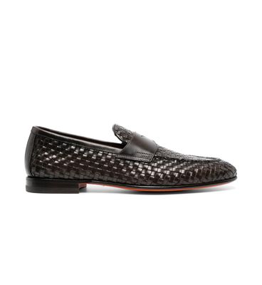 a black loafer with a woven pattern
