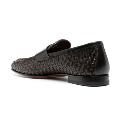 a black loafer with a woven pattern on the side