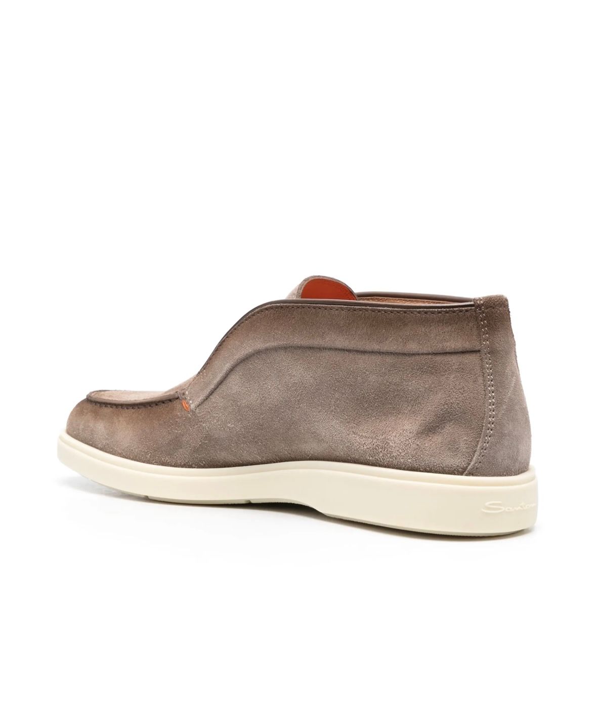 a brown shoe on a white background