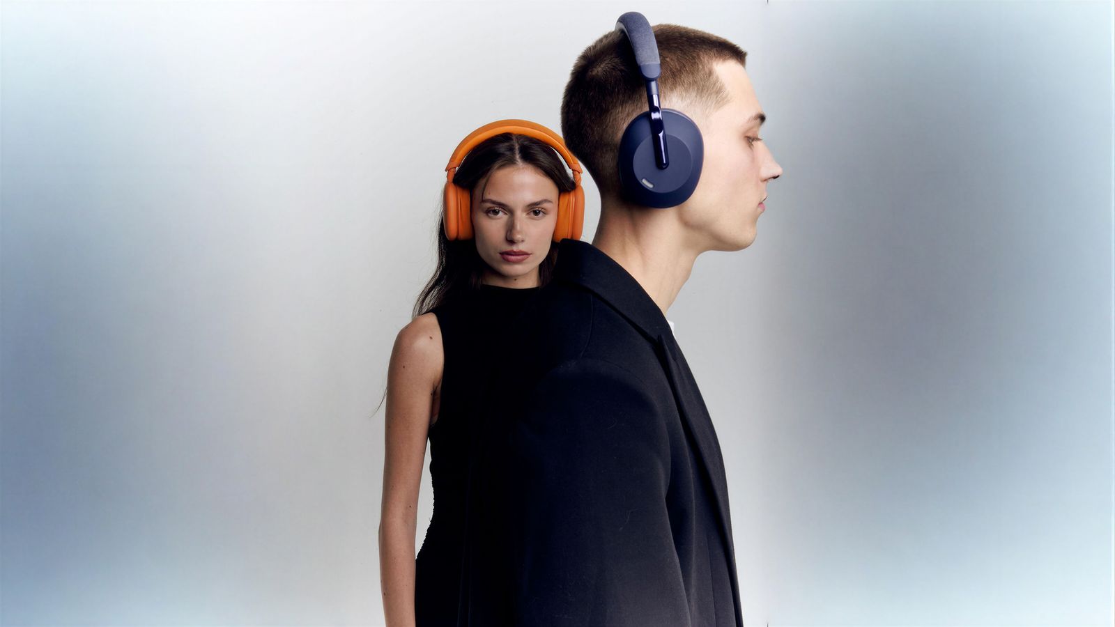 a man and a woman with headphones on