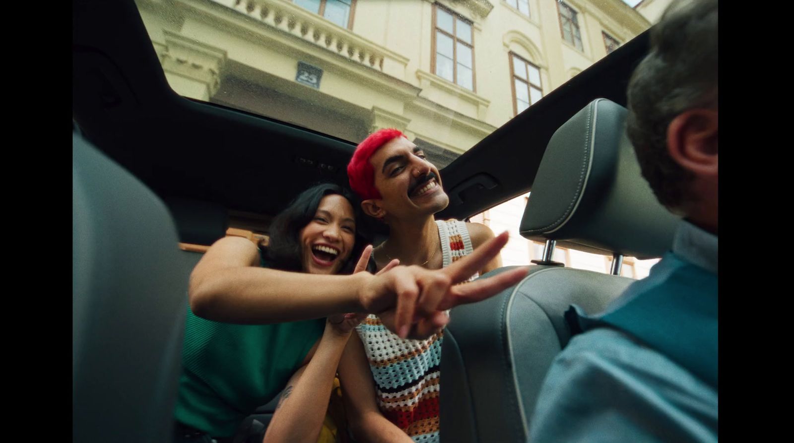 a couple of people that are sitting in a car