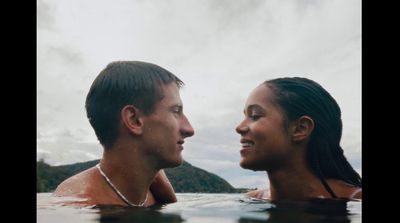 a man and a woman are in the water