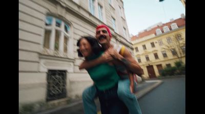 a man and a woman walking down a street