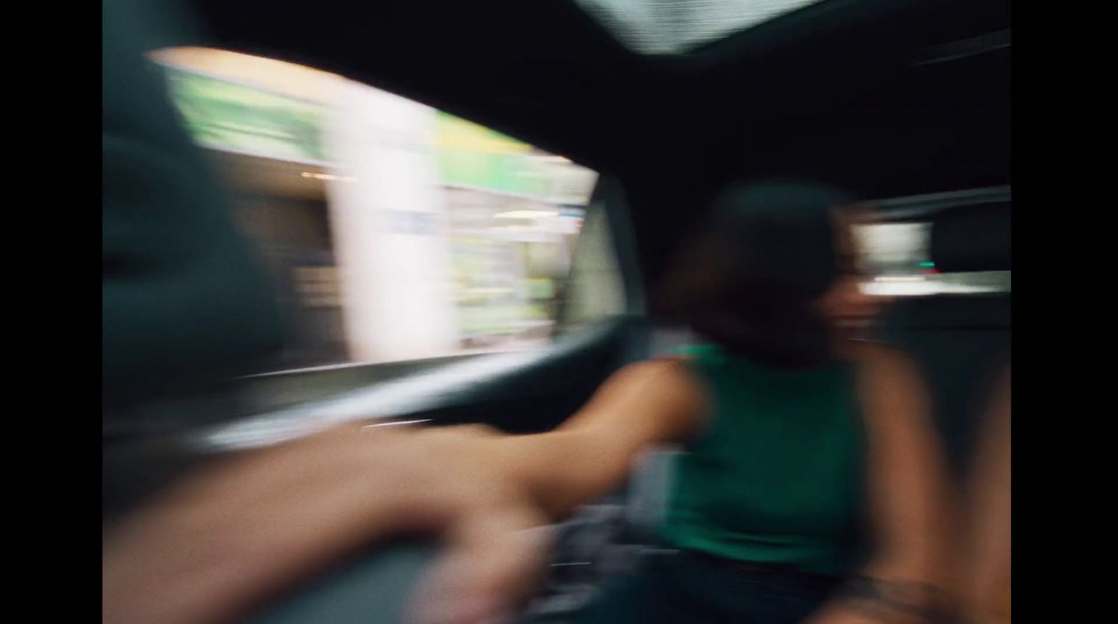 a blurry photo of a person sitting in a car