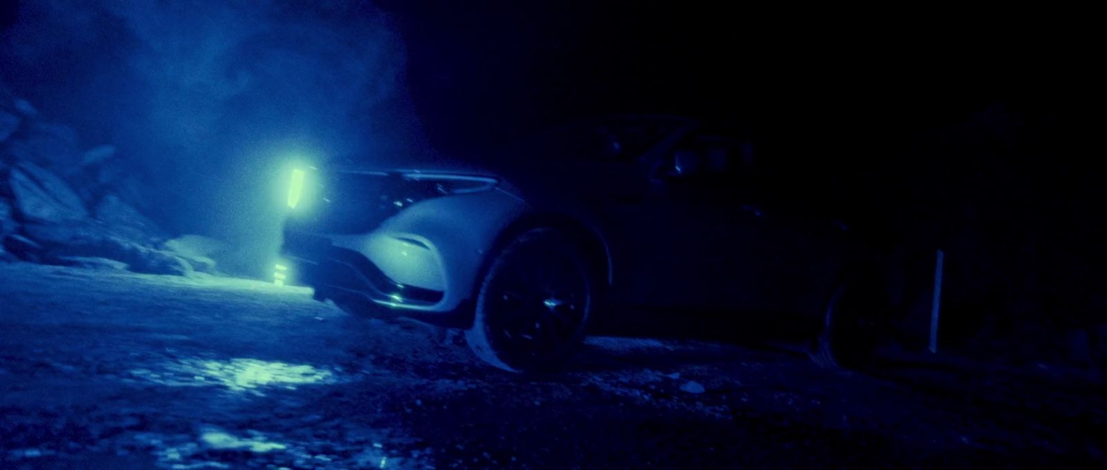 a car parked in the snow at night