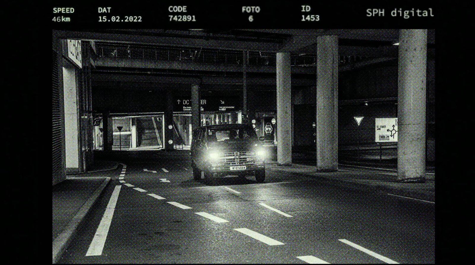 a black and white photo of a train at night