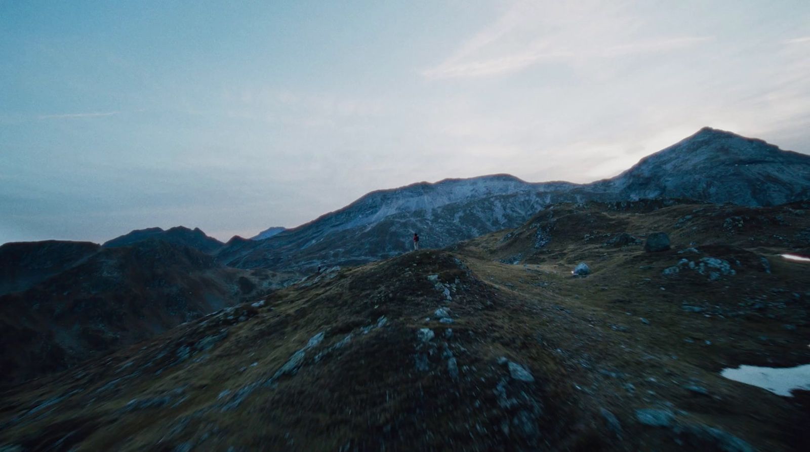 a person standing on top of a mountain