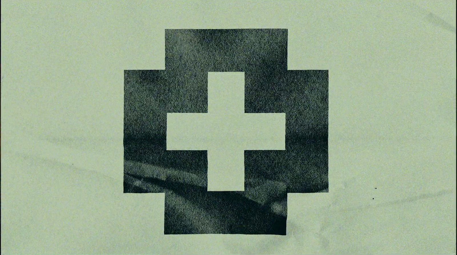 a black and white picture of a cross on a piece of paper