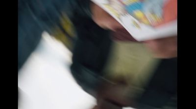 a blurry photo of a person reading a book