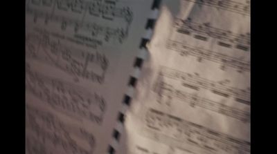 a sheet of paper with music notes on it