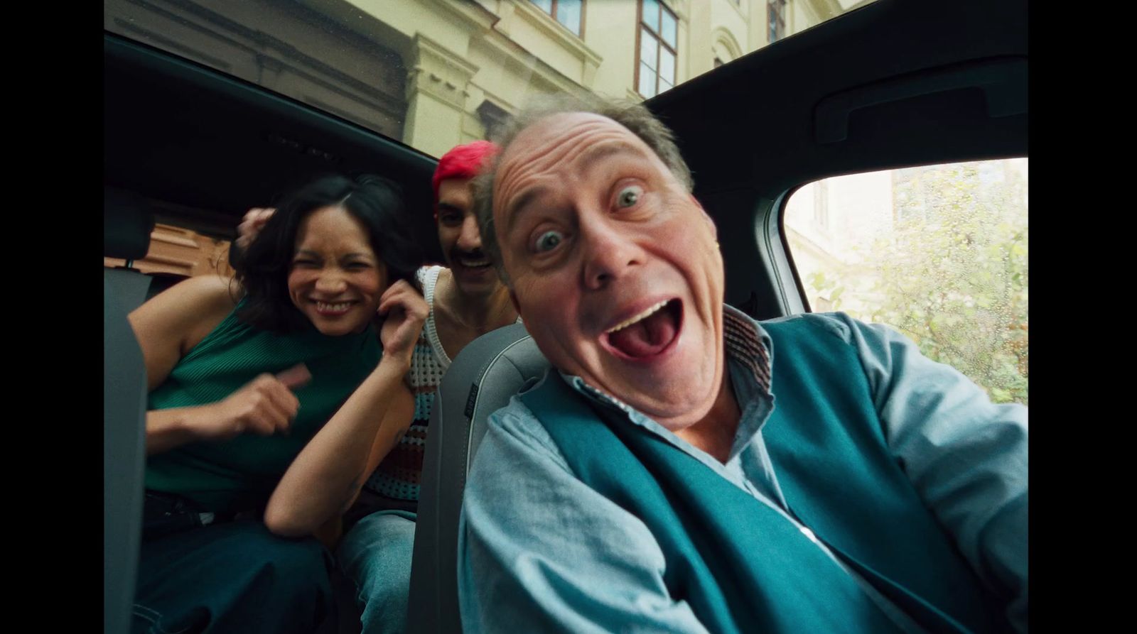 a group of people riding in the back of a truck