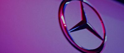 a close up of a mercedes emblem on a car