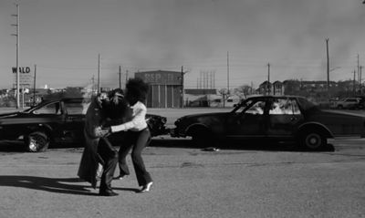 a couple of people that are standing in the street