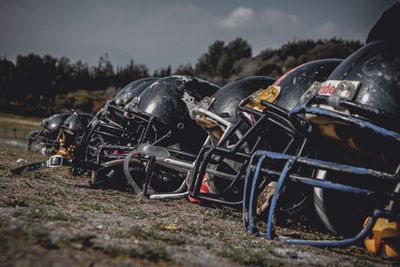 a group of football helmets sitting on top of a field