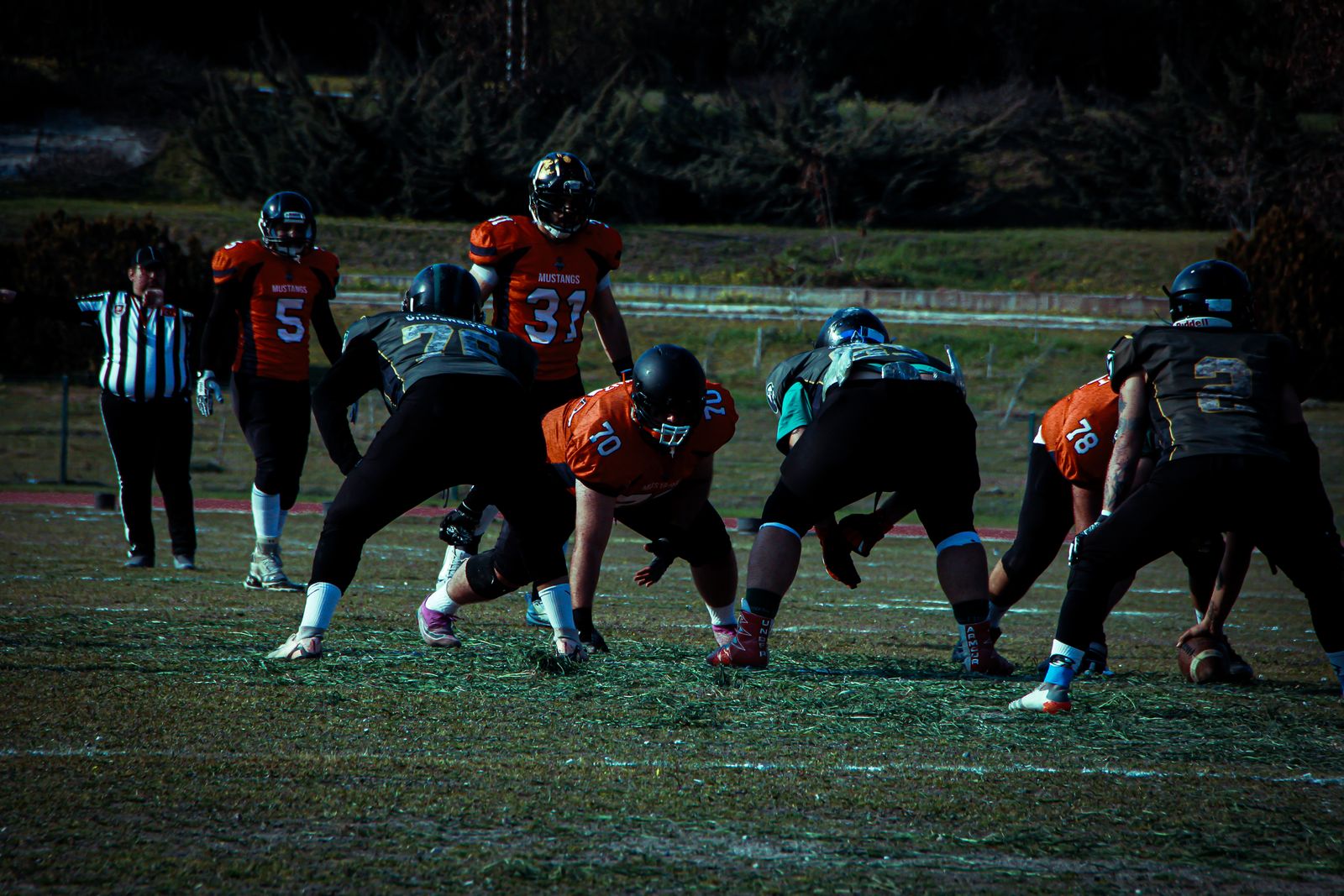 a group of young men playing a game of football
