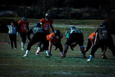 a group of young men playing a game of football