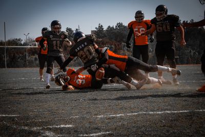 a group of football players playing a game of football