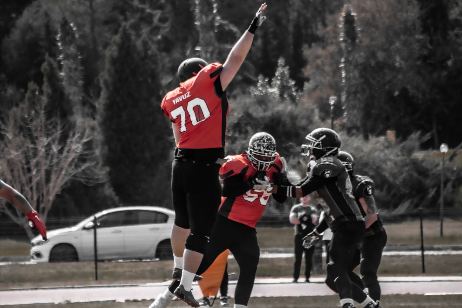 a group of people playing a game of football