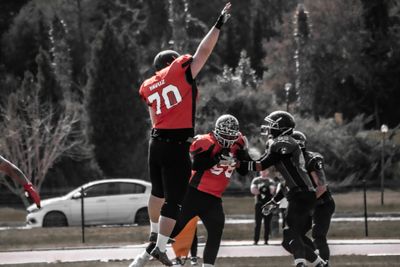 a group of people playing a game of football