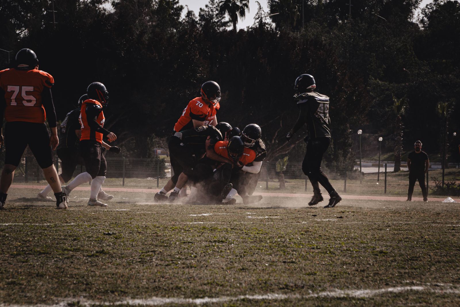 a group of people playing a game of football
