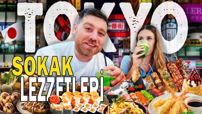 a man and a woman sitting in front of a table full of food
